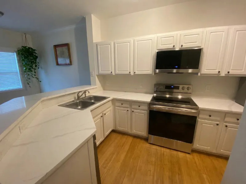 Kitchen wall before new tile backsplash